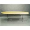 Image 1 : A 1970s oak veneered boardroom table, raised on two cast aluminium stands, 240cm x 124cm wide<...