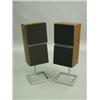 Image 1 : A pair of Bang & Olufsen speakers in rosewood veneered cases, raised on stands Est. 50/80...