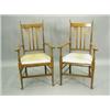 Image 1 : A pair of 'Arts & Crafts' walnut elbow chairs, each with three back splats and shaped flat arm...
