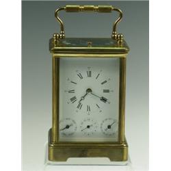 An early 20th Century eight day French brass cased carriage clock with day, date and alarm sub...