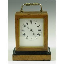 A 19th Century French timepiece in birds eye maple case, the movement with vertical escapement...