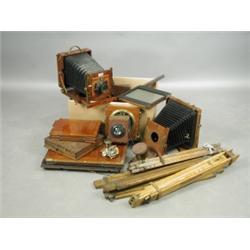 A Sanderson field camera, another similar mahogany and brass camera, a Ross Lens, a Thornton P...