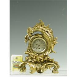 A 19th Century gilt bronze mantel clock, the silvered dial supporting a movement engraved 'Le...