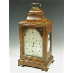A good bracket clock movement, the arched brass dial with a strike/ silent facility and a date...