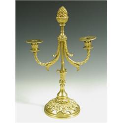 A gilt bronze two branch table lamp surmounted with a pine cone finial, 45cm high Est. 150/...
