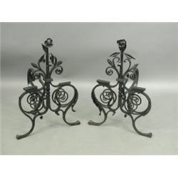 A pair of Victorian wrought iron fire dogs Est. 80/120...