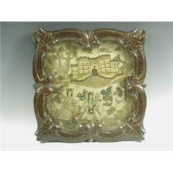An early 18th Century stumpwork picture of two figures before a castle, surrounded by animals,...