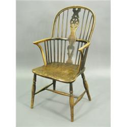 A 19th Century elm seated wheel back Windsor arm chair Est. 250/280...