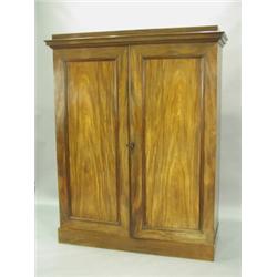 A Victorian mahogany wardrobe, the two panelled doors enclosing slides, drawers and hanging sp...