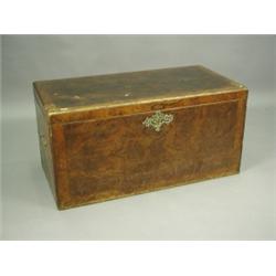 An 18th Century walnut chest, with crossbanded and herringbone stringing and an ornate brass e...