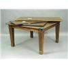 An Edwardian mahogany extending dining table, with three leaves on square tapering and fluted...
