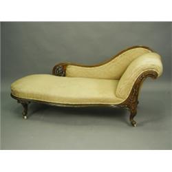 A Victorian carved walnut chaise longue, raised on cabriole legs, 180cm long Est. 400/500...