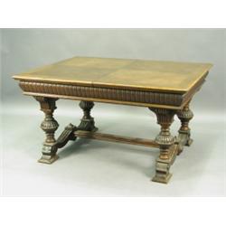 A late 19th Century walnut extending dining table, with a crossbanded top, moulded edges and a...