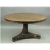 A Victorian rosewood circular top centre table, with a tapering column, raised on a triform ba...