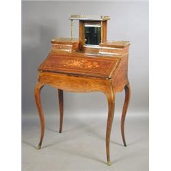 A 19th Century strung and inlaid rosewood bonheur du jour, the shaped fall inlaid with flowers...