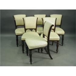 A set of six Victorian mahogany upholstered dining chairs, with turned and reeded legs Est....