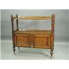 A Victorian oak buffet with two tiers surmounted with gadrooned finials, over two cupboard doo...
