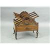 A 19th Century rosewood four division Canterbury with a single base drawer, standing on four s...