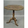 Image 1 : A George III elm snap top tripod table with a one piece top, 76cm diameter, 68cm high Est....