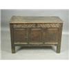 An 18th Century oak coffer with a two plank top above the carved foliate frieze and triple cus...