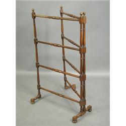 A turned mahogany folding towel rail, 60.5cm x 100cm high Est. 150/200...