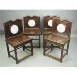 Four 19th Century Chinese hardwood single chairs, the backs with shaped crest rails and marble...