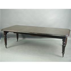 A Victorian mahogany extending dining table with a moulded top, three extra leaves (one replac...