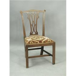 A single George III mahogany dining chair with a shaped top rail, pierced splat and drop in se...