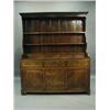 Image 1 : A George III oak Welsh dresser, the moulded cornice over three graduated shelves and five spic...