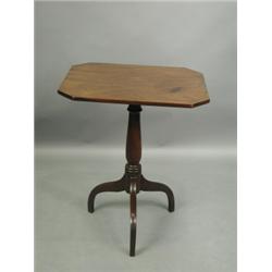 A 19th Century mahogany tripod table, the solid top of rectangular shape with canted corners<b...