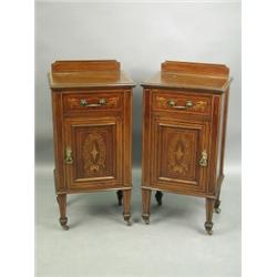 A pair of Edwardian inlaid mahogany pot cupboards, each with a single drawer and cupboard, wit...