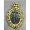 Image 1 : A 19th Century Italian oval wall mirror in a carved and gilt frame, now painted gold, 72cm hig...