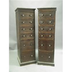 A pair of Victorian grained pine tall chests, each with six graduated drawers on plinth bases,...