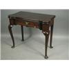 Image 1 : A George I mahogany tea table with rounded corners, a drawer and a vertically veneered frieze,...