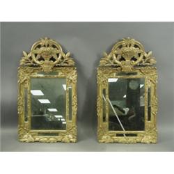 A pair of Louis XIV style giltwood wall mirrors, 94cm high Est. 300/500...