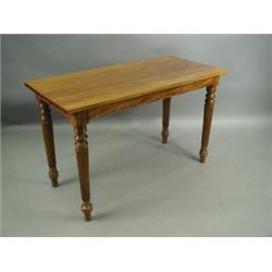 A late 19th Century colonial solid satinwood centre table on turned and reeded legs, 122cm lon...