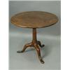 Image 1 : A George III mahogany tripod table, with a single piece circular top, and a birdcage action, o...