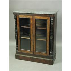 A Regency period rosewood pier cabinet, the later marble top over a pair of glazed doors, betw...