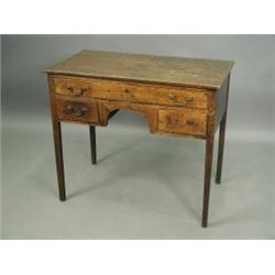 An early 19th Century oak lowboy, with one long and two short drawers, on square tapering legs...