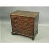 Image 1 : A George III mahogany chest, of small proportions, the well figured top above a slide and four...