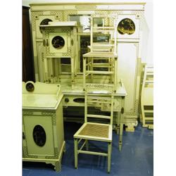 A Waring & Gillows nine piece bedroom suite, decorated in chinoiserie style, (comprising: trip...