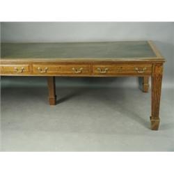 A large oak and leather top boardroom table, with four drawers either side, raised on square flut...