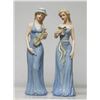 Beautiful Set of 2 Porcelain women figurines holding in