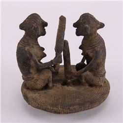 Pre-Columbian metal artifact of two indigenous people