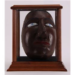 Antique black mask from unknown origin.  Our