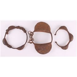 Three (3) 19th Century African slave hand cuffs.
