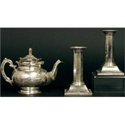 A late 19th Century Chinese white metal bachelor's teapot, the lid with foliate finial, the body...