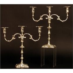 A pair of modern three branch candelabra, the detachable sconces with shell decoration, scrolled...