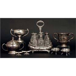 An early 20th Century George III style twin handled trophy cup and cover, twin bands, on a steppe...