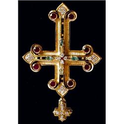 A cross, measuring approximately 65 x 45mm, set with rubies, marquise cut emeralds and diamonds,...